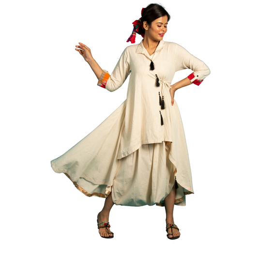 This unique Asymmetric Linen Wraparound Dress comes with matching dhoti pants for a classic and chic look. Made of cool and breathable linen, this wrap dress is both fashionable and easy to wear. Perfect for any occasion, it's a must-have for the fashion-forward and quirky dresser!